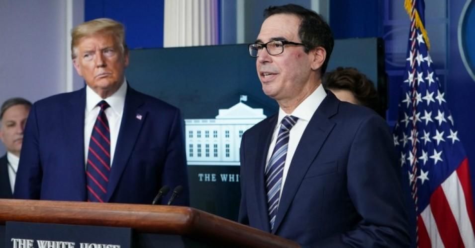 Secretary of the Treasury Steve Mnuchin speaks while President Donald Trump listens during the daily briefing on the novel coronavirus, COVID-19, in the Brady Briefing Room at the White House on April 2, 2020, in Washington, D.C. 
