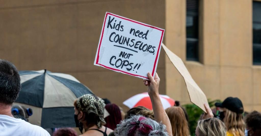 A protester holding a "kids need counselors not cops sign" in St. Paul, Minnesota. (Photo: Michael Siluk/Education Images/Universal Images Group via Getty Images)
