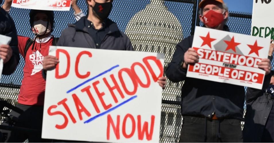 Activists hold signs as they take part in a rally in support of D.C. statehood near the U.S. Capitol in Washington, D.C. on March 22, 2021. (Photo: Mandel Ngan/AFP via Getty Images)