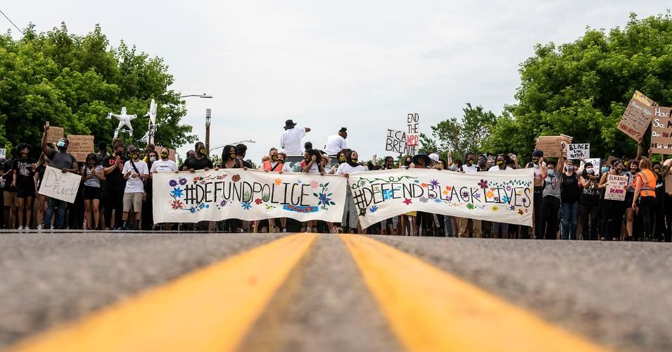 Demonstrators calling to defund the Minneapolis Police Department march on University Avenue on June 6, 2020, in Minneapolis. The march, organized by the Black Visions Collective, commemorated the life of George Floyd, who was killed by Minneapolis police officers on May 25. 