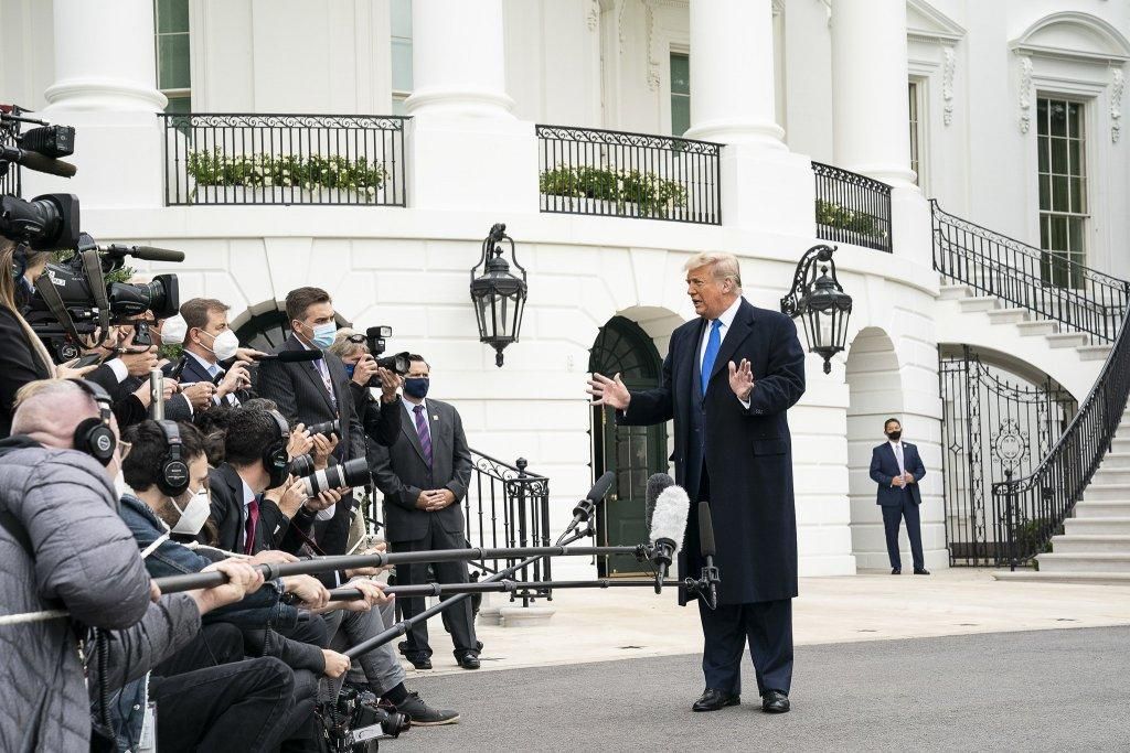 President Donald J. Trump talks to members of the press on the South Lawn of the White House Tuesday, Oct. 27, 2020, prior to boarding Marine One en route to Joint Base Andrews, Md. to begin his trip to Michigan, Wisconsin, Nebraska and Nevada. (Photo: Official White House Photo by Joyce N. Boghosian)