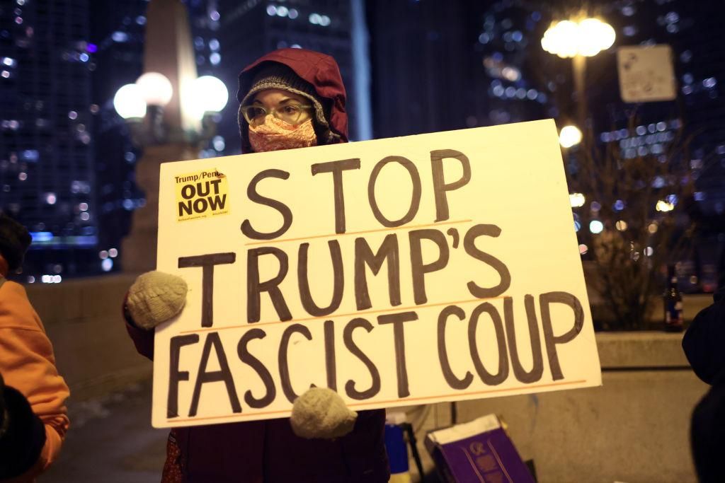 A small group of demonstrators protest near Trump Tower on January 07, 2021 in Chicago, Illinois. They called for the removal of President Donald Trump from office after a pro-Trump mob stormed the Capitol building in Washington, DC yesterday as lawmakers met to count the Electoral College votes in the presidential election. (Photo: Scott Olson/Getty Images)