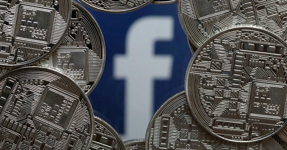  In this photo illustration, a visual representation of digital cryptocurrency coins sit on display in front of a Facebook logo on June 24, 2019 in Paris, France. Since the announcement of its creation last week, the virtual currency of Facebook Libra fascinates as much as it worries. (Photo: Chesnot/Getty Images)