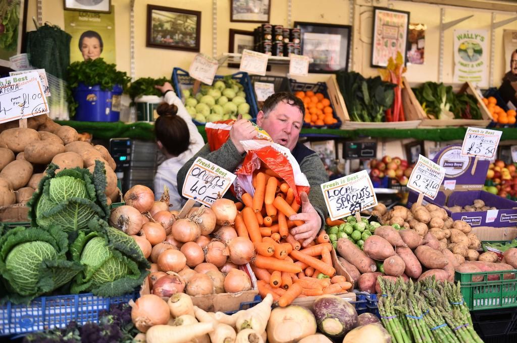 A man prepares his green grocer market stall at Stockport Market on March 12, 2021 in Stockport, England. (Photo: Nathan Stirk/Getty Images)