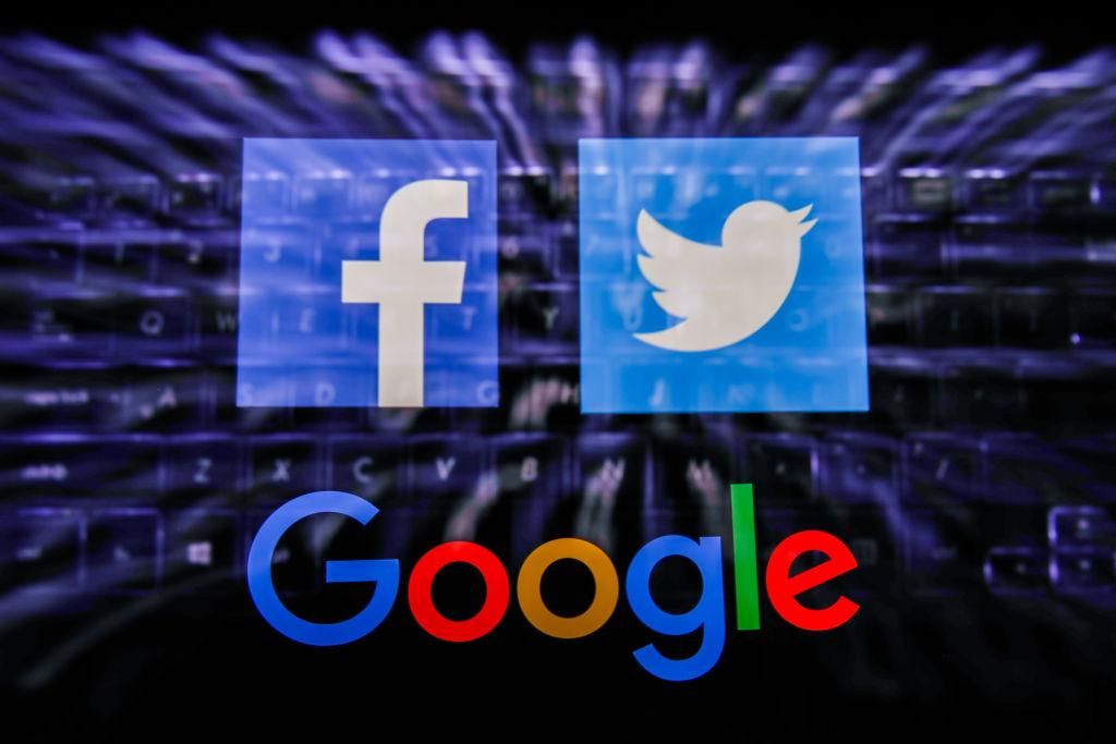  FacebookGoogleTwitter use robot algorithm curators that are on automatic pilot, much like killer drones for which no human bears responsibility or liability. That’s dangerous in a democracy. (Photo Illustration by Jakub Porzycki/NurPhoto via Getty Images)