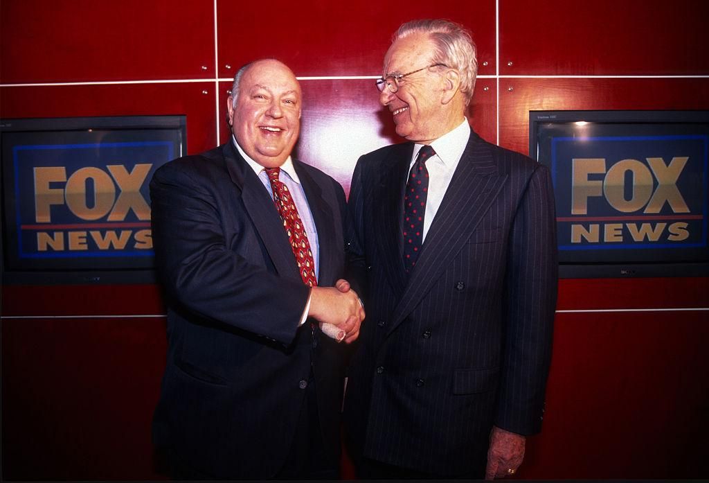 Rupert Murdoch shakes hands with Roger Ailes after naming Ailes the head of Fox News, New York, New York, January 30, 1996. (Photo by Allan Tannenbaum/Getty Images)