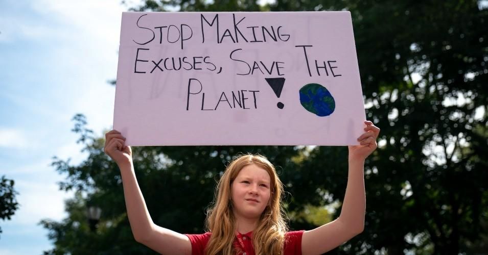 A young activist holds a sign during a rally for action on climate change on September 20, 2019 in New York City. Thousands of young people across the globe are participating in a day of protest calling for urgent action to fight climate change in what organizers are calling the Global Climate Strike. (Photo: Drew Angerer/Getty Images)
