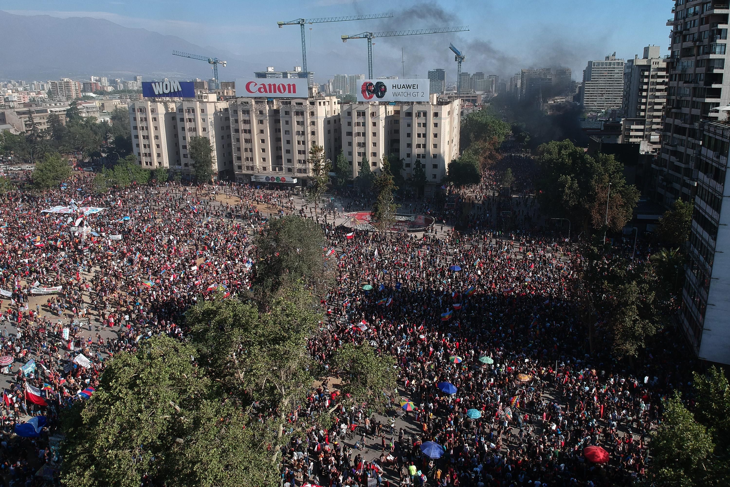Aerial view as demonstrators march during a national strike and general demonstration called by different workers unions on November 12, 2019 in Santiago, Chile. On Sunday, Government announced it has agreed to start the process to write a new Constitution for the country, which is one of the most repeated demands by the demonstrators since October 18. (Photo by Marcelo Hernandez/Getty Images)