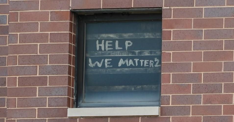 The words "help we matter 2" are seen written in a window at the Cook County Department of Corrections (CCDOC), housing one of the nation's largest jails, is seen in Chicago, on April 9, 2020. (Photo: Kamil Krzaczynski/AFP via Getty Images)