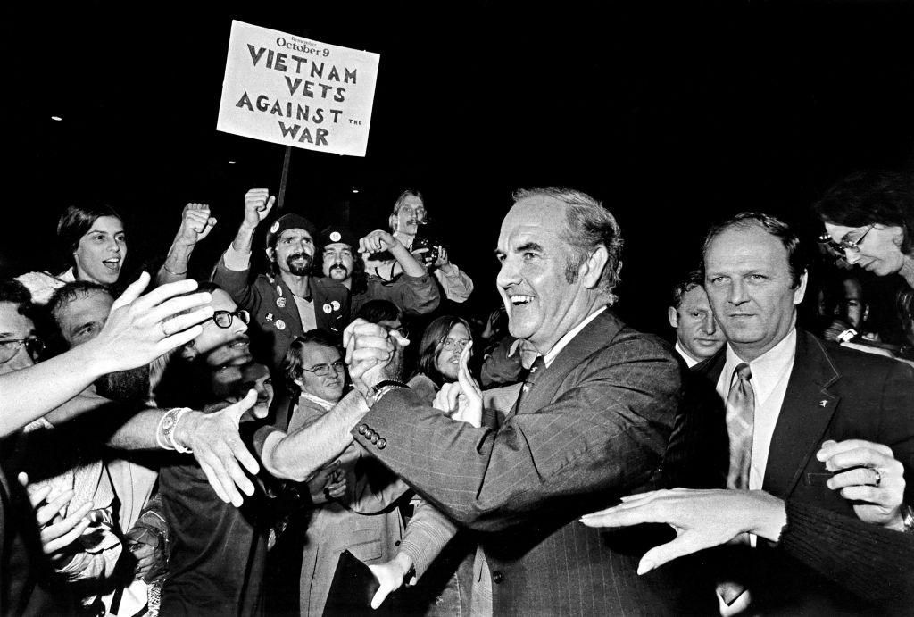 While Dems failed to get an antiwar candidate nominated in 1968, the movement was alive and influential within the party. In 1972, McGovern (pictured above) was nominated. His landslide loss empowered the nation’s pro-war interests to marginalize progressives for the next half-century. (Photo by Ron Pownall/Michael Ochs Archives/Getty Images)
