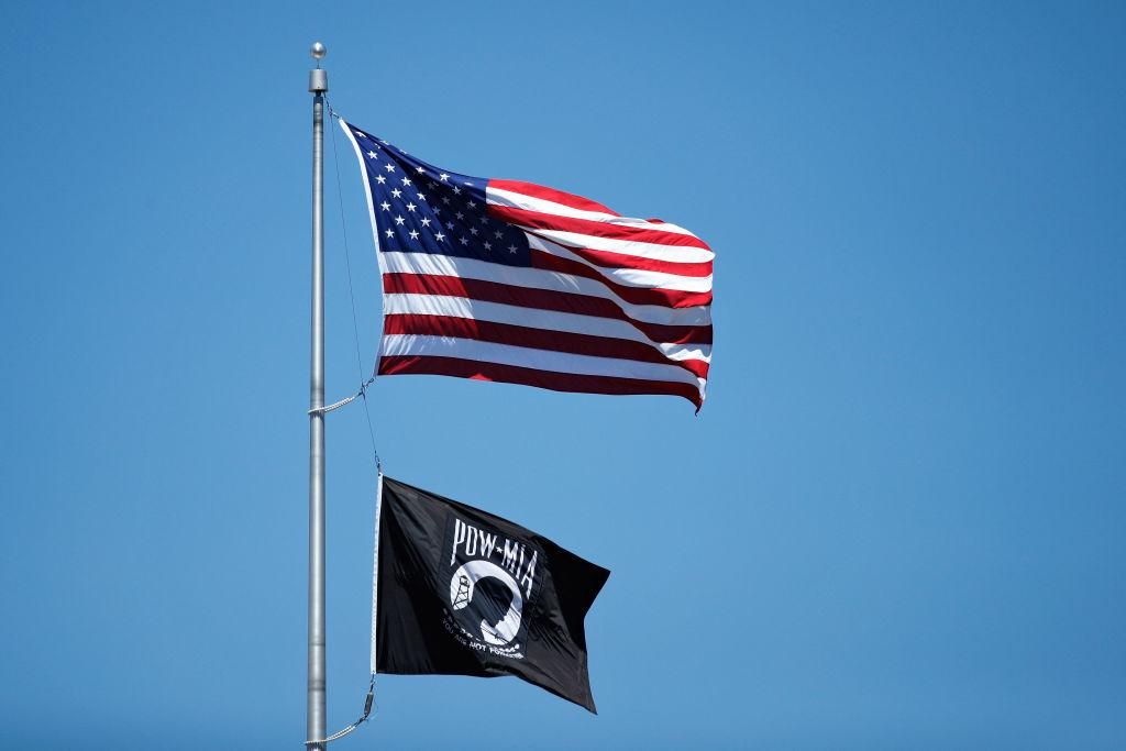 The next time you see a POW/MIA flag outside a federal building, don’t dismiss it as a relic of America’s past. Think about its meaning and relevance in an era of constant global warfare and colossal military spending. (Photo by Joe Robbins/Getty Images)