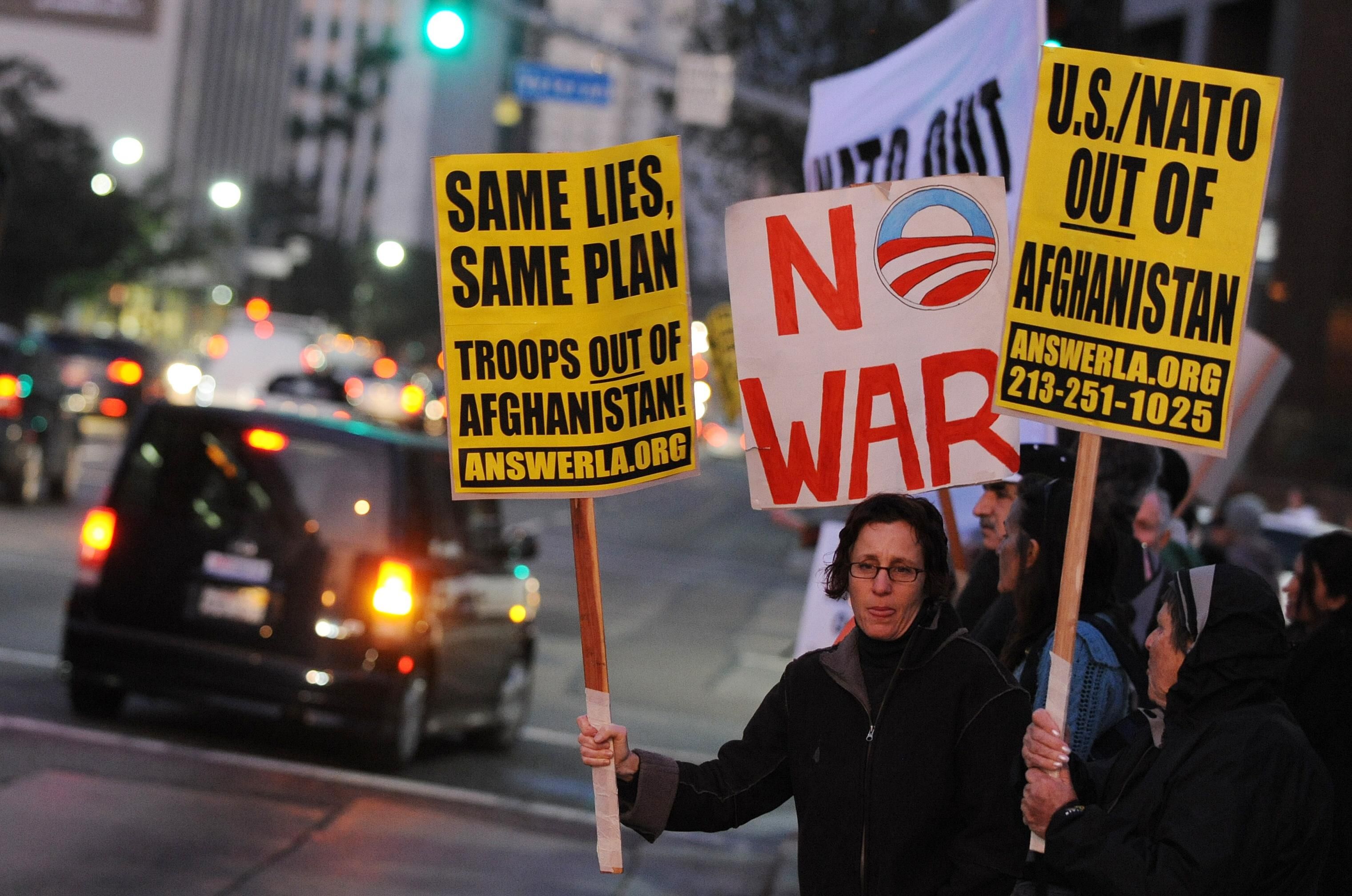 Anti-war demonstrators protest against the announcement of a US troop increase for Afghanistan, at a rally outside the Federal Building in Los Angeles on December 2, 2009. (Photo: MARK RALSTON/AFP/Getty Images)