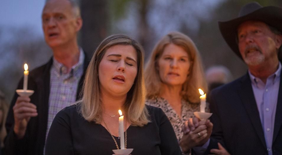 People attend a prayer and candlelight vigil at Rancho Bernardo Community Presbyterian Church on Saturday, April 27, 2019 in Poway, California.