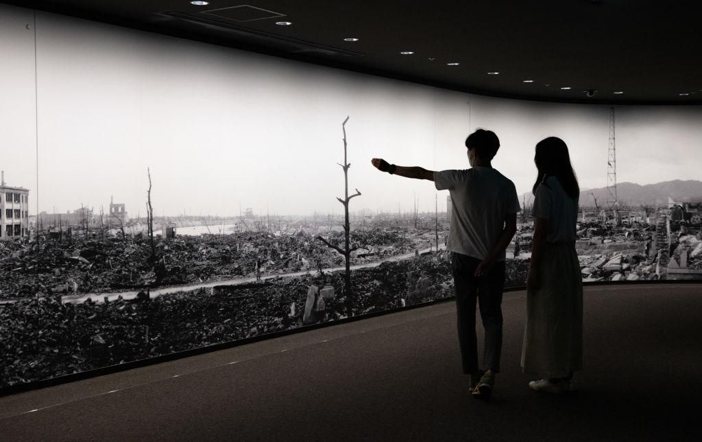 Visitors to Hiroshima Peace Memorial Museum view a large scale panoramic photograph of the aftermath of the atomic bomb attack on Hiroshima, on August 5, 2020 in Hiroshima, Japan. Between 90,000 to 146,000 people were killed and the entire city destroyed in the first use of a nuclear weapon in armed conflict. (Photo by Carl Court/Getty Images)