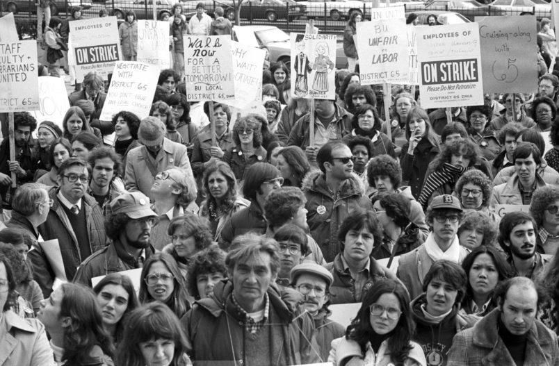 View of students and faculty carrying signs during a strike by faculty and staff of Boston University, on Commonwealth Avenue, Boston, 1979. Historian Howard Zinn, then a professor at BU, is visible in the foreground. (Photo by Spencer Grant/Getty Images)