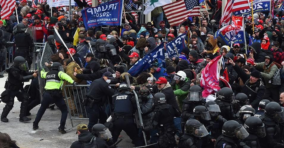 Donald Trump-incited insurrectionist mob clashes with security forces as they push barricades to storm the US Capitol in Washington D.C on January 6, 2021. (Photo/ROBERTO SCHMIDT/AFP via Getty Images)