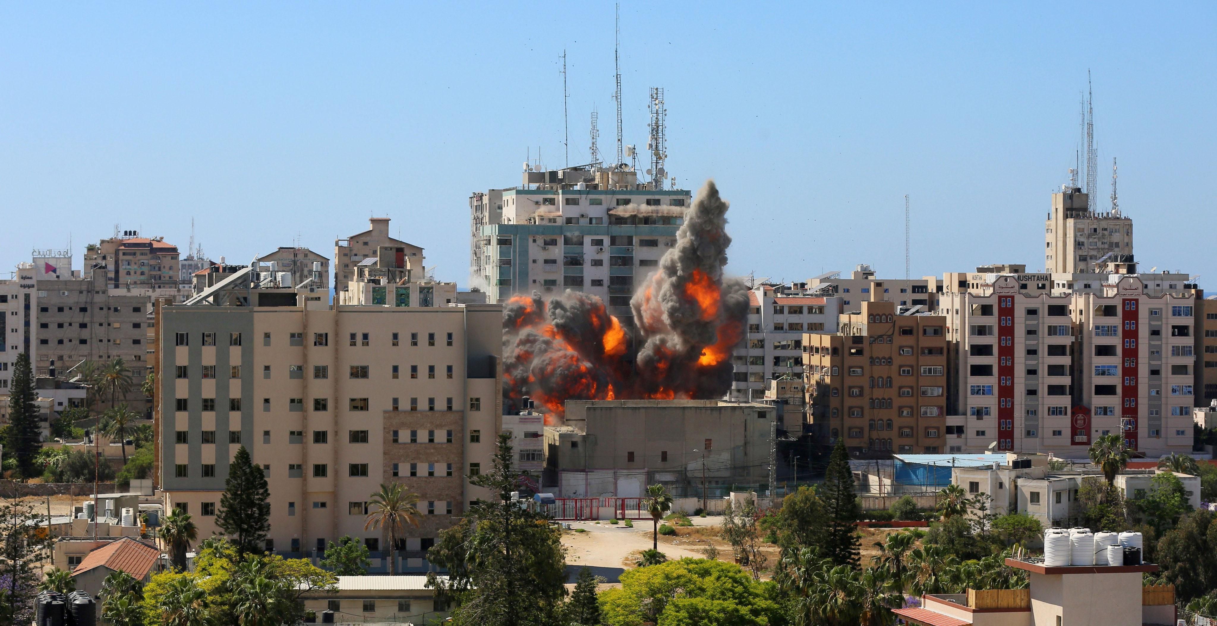 A view of a 11-story building housing AP office and other media in Gaza City is seen moments after Israeli warplanes demolished it, Saturday, May 15, 2021. There was no immediate explanation for why the building was targeted. The building housed The Associated Press, Al-Jazeera and a number of offices and apartments.