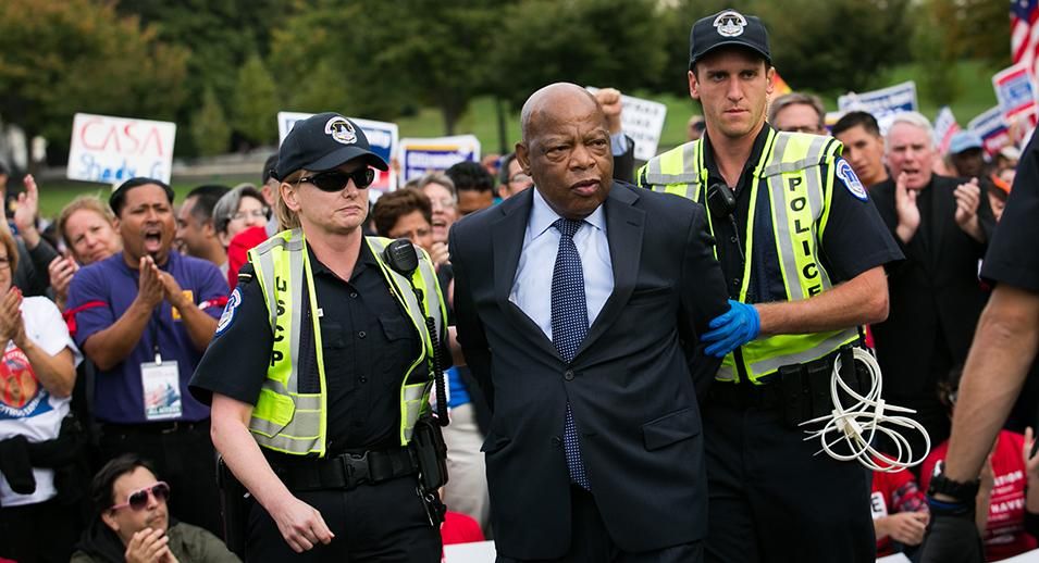 Rep. John Lewis (D-GA) is arrested by U.S. Capitol Police after blocking First Street NW in front of the U.S. Capitol with fellow supporters of immigration reform, on October 8, 2013 in Washington, DC.