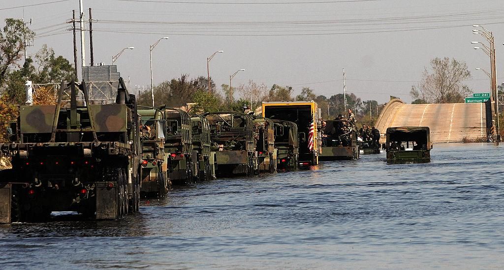  A US military unit crosses the flooded area of interstate 10 eastside New Orleans, Lousiana on September 8, 2005. (Photo: Omar Torres/AFP via Getty Images)