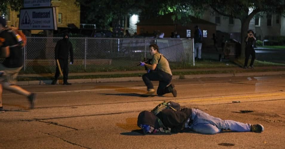 A man on the ground was shot during the third day of protests over the police shooting of Jacob Blake in Kenosha, Wisconsin on August 25, 2020. (Photo: Tayfun Coskun/Anadolu Agency via Getty Images)