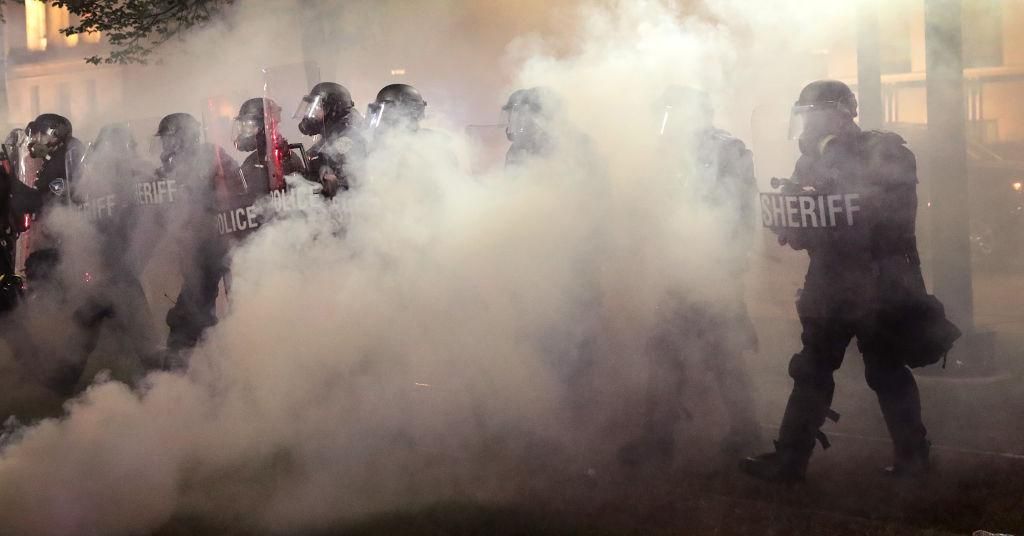 Policy walk, as tear gas fills the air, near the Kenosha County Courthouse during a third night of unrest on August 25, 2020 in Kenosha, Wisconsin. (Photo: Scott Olson/Getty Images)