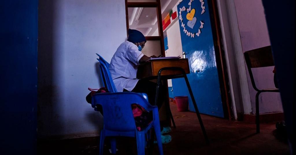 A student sits at her desk along a corridor at Kibera School for Girls, in Nairobi, on August 7, 2020. Students from the surrounding area who are facing challenges accessing the internet for virtual learning at home are permitted to study at the premises in order to access the Wi-Fi. (Photo: Tony Karumba/Afp via Getty Images)