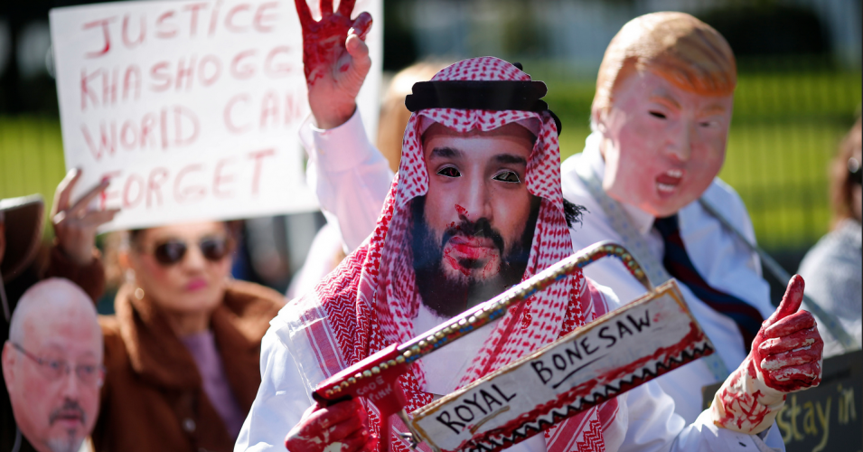 A protester dressed as Saudi Crown Prince Mohammad bin Salman and another dressed as U.S. President Donald Trump stand outside the White House in the wake of the disappearance of the Saudi journalist Jamal Khashoggi on Oct. 19. (Photo: Win McNamee/Getty Images)