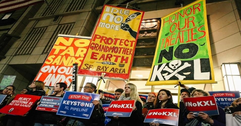 President Donald Trump reversed former President Barack Obama's decision on the Keystone XL pipeline in 2017, drawing protests. Big banks have also been targeted for their continued funding of dirty fossil fuels projects. (Photo: Rainforest Action Network/Bonnie Chan/flickr/cc)