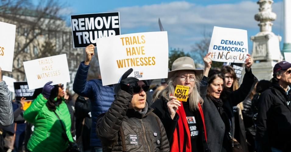 Activists participate in a rally calling for witnesses in the Senate impeachment trial of U.S. President Donald Trump at the U.S. Capitol in Washington, D.C. January 29, 2020. 