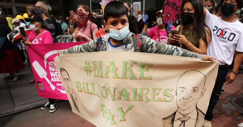 People participate in a "March on Billionaires" event on July 17, 2020 in New York City. (Photo by Spencer Platt/Getty Images)
