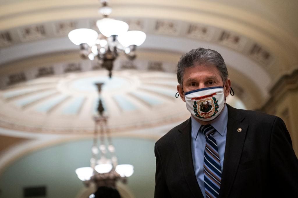 Sen. Joe Manchin (D-WV) walks to the Senate Chamber on the third day of former President Donald Trump's second impeachment trial at the U.S. Capitol on February 11, 2021 in Washington, DC. (Photo by Drew Angerer/Getty Images)