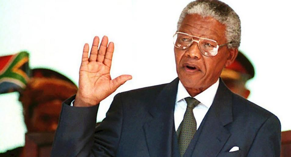 Former President Nelson Mandela takes the oath on May 10, 1994, during his inauguration at the Union Building in Pretoria, South Africa.