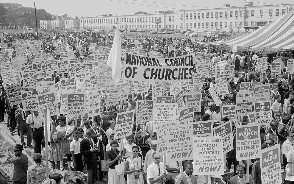 Marchers, signs, and tent at the March on Washington, 1963