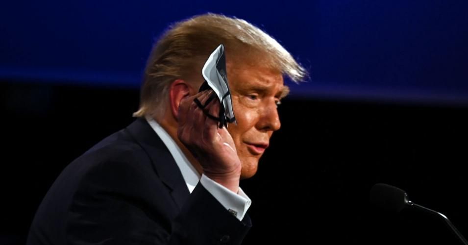US President Donald Trump holds a face mask as he speaks during the first presidential debate at the Case Western Reserve University and Cleveland Clinic in Cleveland, Ohio on September 29, 2020. (Photo: Jim Watson/AFP via Getty Images)