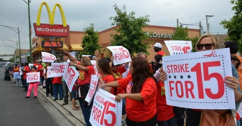 Workers and allies demanding a $15 an hour wage stage a protest outside a McDonald's restaurant. (Photo: Steve Rhodes/flickr/cc)