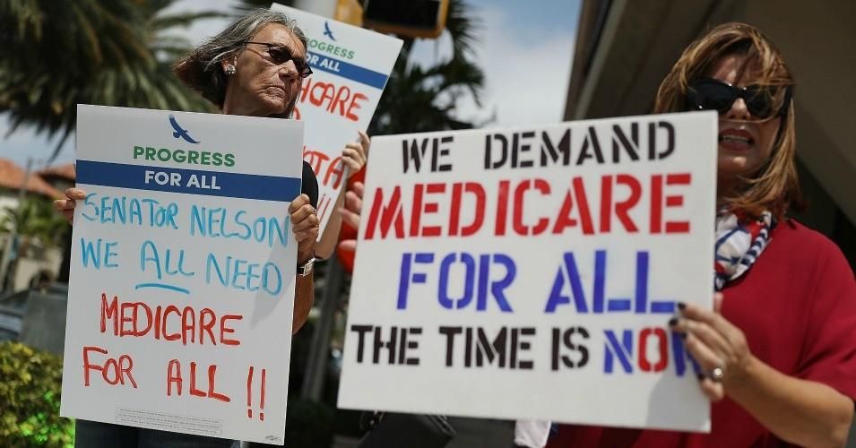 Protesters stand together outside the office of Sen. Bill Nelson (D-FL) asking him to work on a health care policy on April 4, 2017 in Coral Gables, Florida. 