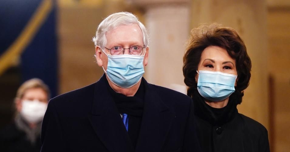 Sen. Mitch McConnell (R-Ky.) and former Secretary of Transportation Elaine Chao arrive for the inauguration of President Joe Biden on January 20, 2021 at the U.S. Capitol in Washington, D.C. (Photo: Jim Lo Scalzo/AFP via Getty Images)