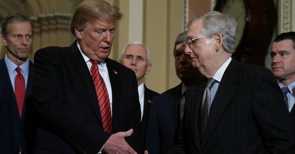 President Donald Trump shakes hands with Senate Majority Leader Sen. Mitch McConnell (R-Ky.) inside the U.S. Capitol building. (Photo: Alex Wong/Getty Images)