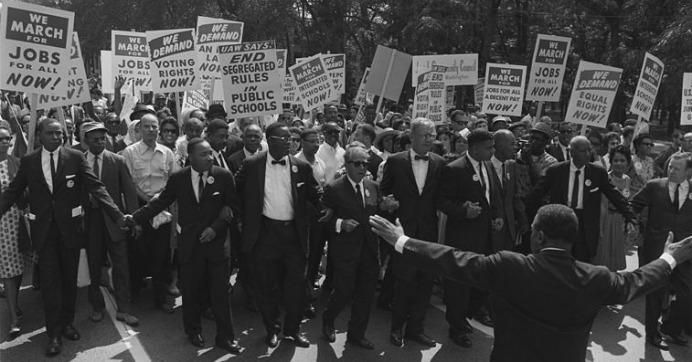 Civil rights and union leaders, including Martin Luther King Jr., Joseph L. Rauh Jr., Whitney Young, Roy Wilkins, A. Philip Randolph, Walter Reuther, and Sam Weinblatt, take part in the March on Washington for Jobs and Freedom on August 28, 1963. 
