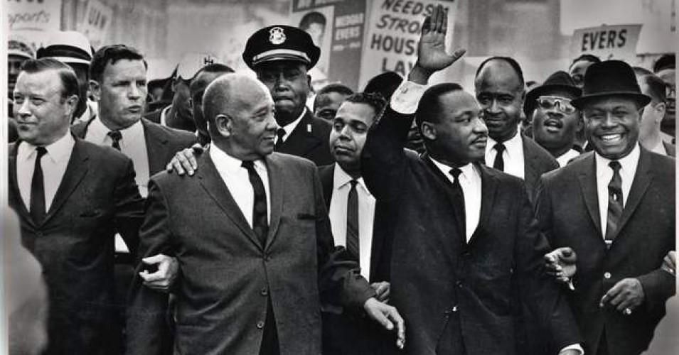 The Rev. Martin Luther King Jr. waves to onlookers while leading the 125,000 strong 'Walk to Freedom' on Woodward Avenue in Detroit in 1963. (Photo: Tony Spina / Detroit Free Press)