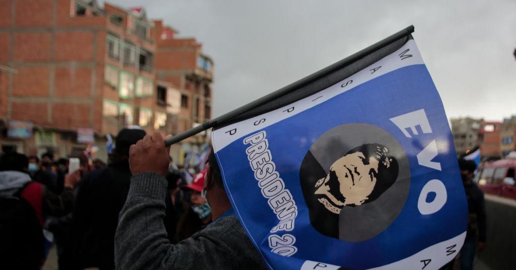 A man holds a flag with a picture of former Bolivian President Evo Morales during the first campaign event of MAS party ahead of presidential elections on September 9, 2020 in El Alto, Bolivia. (Photo: Gaston Brito/Getty Images)