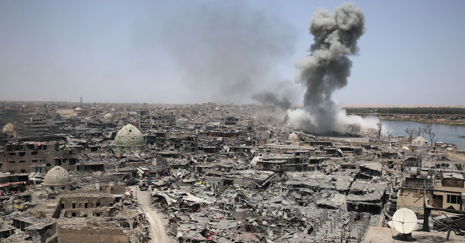 U.S. bombs and bullets have claimed at least hundreds of thousands of civilian lives this century. Here, a U.S. airstrike against Islamic State militants in densely-populated Mosul, Iraq on July 9, 2017 is shown. (Photo: Ahmad Al-Rubaye/AFP/Getty Images)