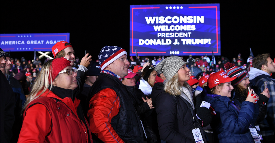 Supporters listen to US President Donald Trump speak during a campaign rally at Waukesha County Airport in Waukesha, Wisconsin on October 24, 2020. (Photo: Mandel Ngan/AFP via Getty Images)