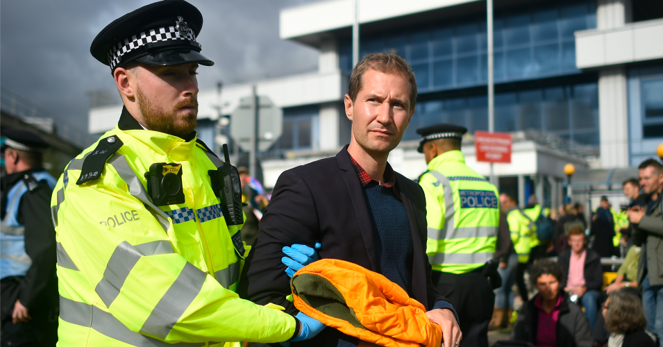 The author, Nathan Williams, is removed by police as climate change action group Extinction Rebellion staged a protest at London City Airport during the fourth day of demonstrations on October 10, 2019 in London, England. Climate change activists have gathered to block access to various government departments as they launch a two week protest in central London. (Photo: Peter Summers/Getty Images)