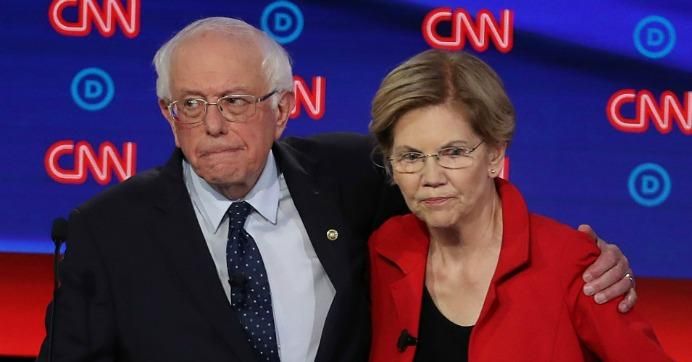 Democratic presidential candidate Sen. Bernie Sanders (I-Vt.) (L) and Sen. Elizabeth Warren (D-Mass.) embrace after the Democratic Presidential Debate at the Fox Theatre July 30, 2019 in Detroit