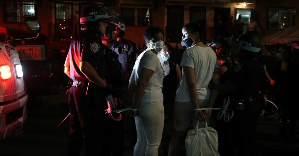 Police officers arrest protesters for breaking the curfew as they continued to protest demanding an end to police brutality and racial injustice over the death of George Floyd on June 4, 2020 in New York City. (Photo: Tayfun Coskun/Anadolu Agency via Getty Images)