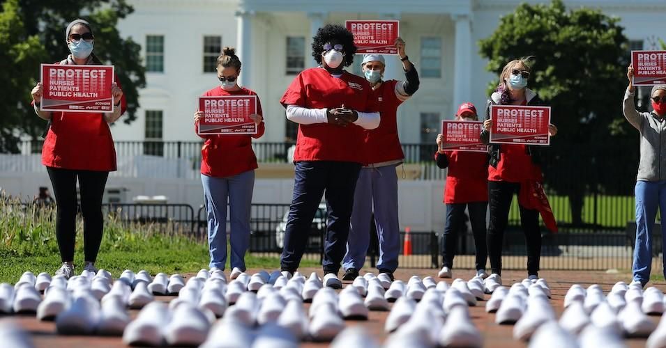 Members of National Nurses United stand in protest among empty shoes representing nurses who have died from Covid-19 in Lafayette Park across from the White House May 07, 2020. (Photo: Chip Somodevilla/Getty Images)