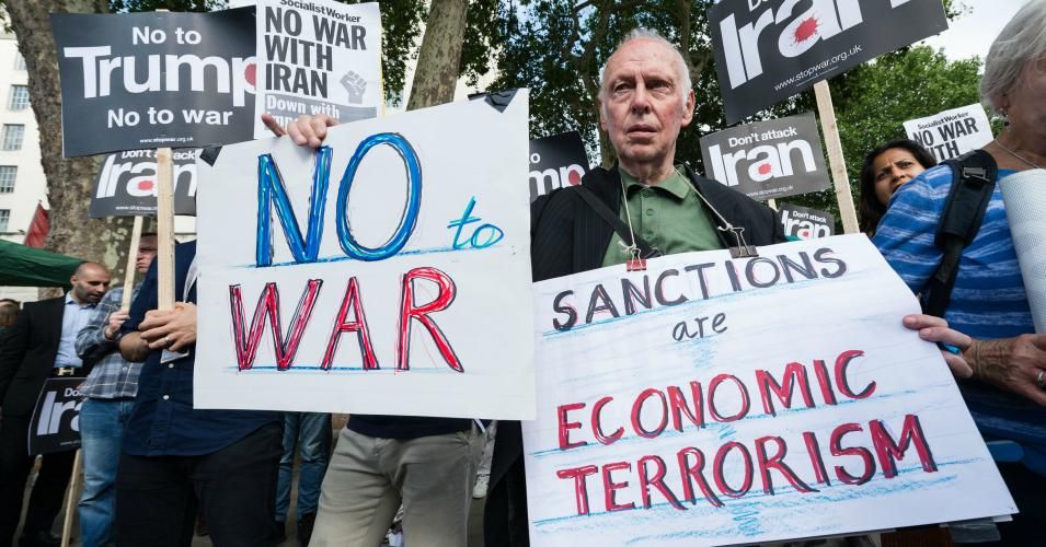 Anti-war demonstrators gather outside Downing Street on 26 June, 2019 in London, England, to call on the government to publicly oppose the escalation of conflict between Donald Trump's administration and Iran and demand that military action is ruled out. (Photo: Wiktor Szymanowicz / Barcroft Media via Getty Images)