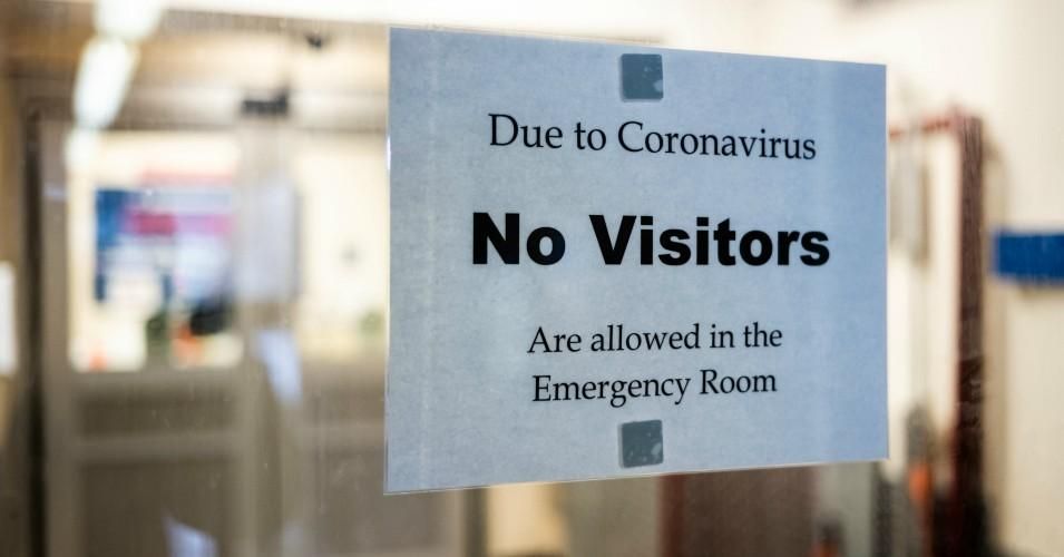 A sign is posted on the door of the Emergency Department at St. Barnabas Hospital on March 23, 2020 in the Bronx borough of New York City.
