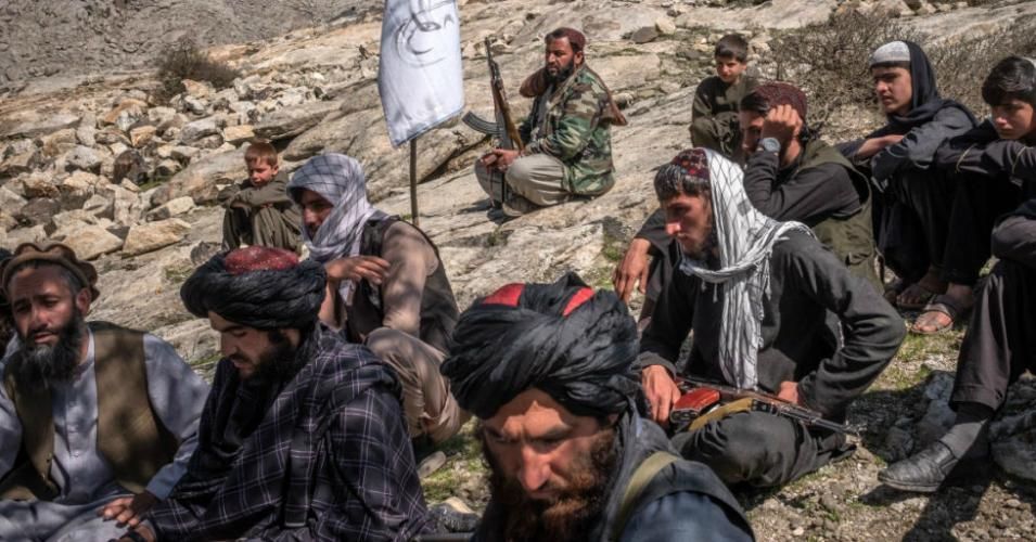 Taliban members gathered under a tree in March in Alingar District of Laghman Province, Afghanistan. 